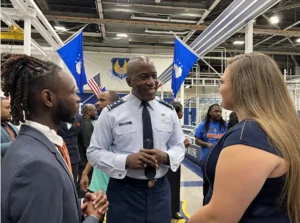 SGA Student President Nathaniel Rakestraw Edwards and SGA Vice President Hannah Wall talk with an Air Force officer